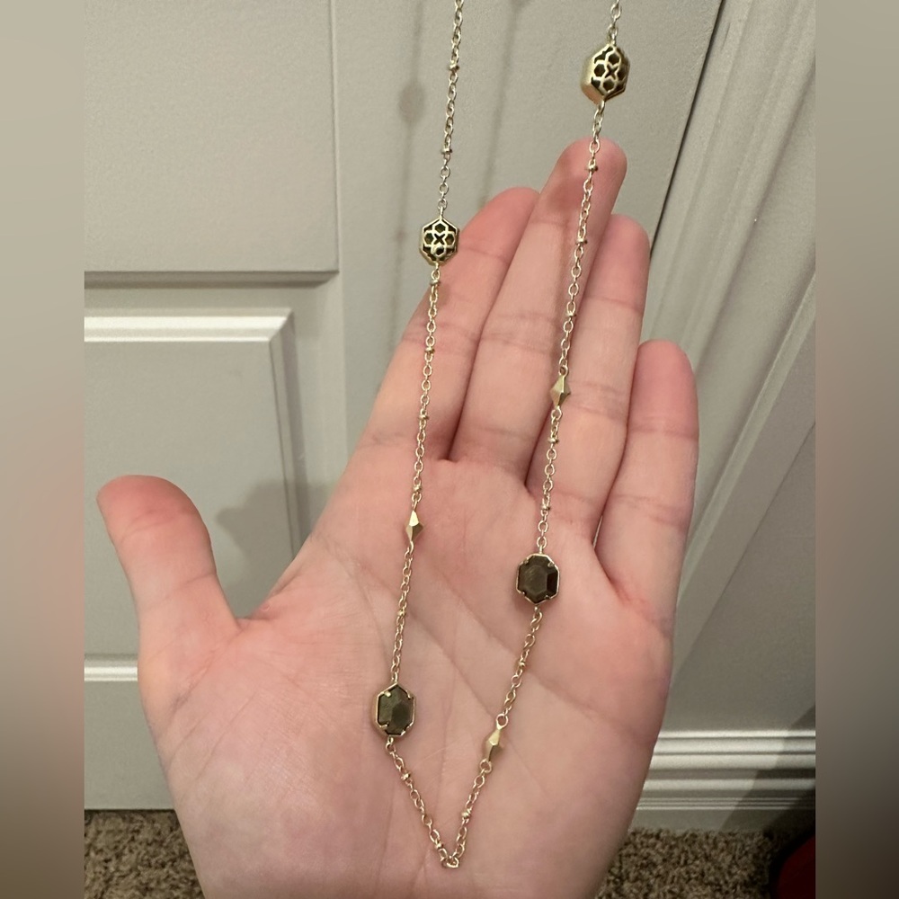 NWT! Kendra Scott long gold necklace with olive like color pendant details.
